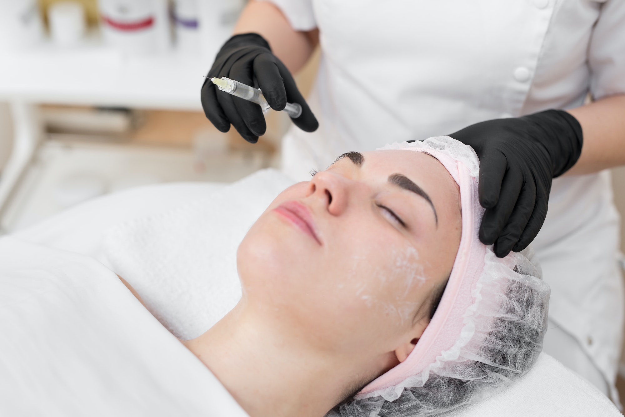 Woman face cosmetology treatment. Biorevitalization skin therapy. Injecting in medical salon. The